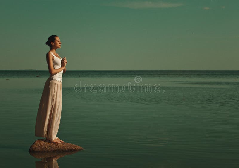 Woman meditating in a yoga pose