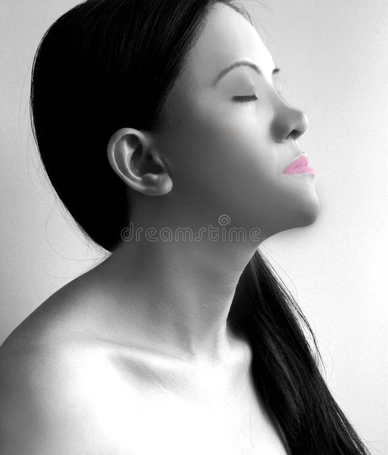 Beautiful asian woman with long black hair and pink lips contemplating and in meditation with closed eyes. Fit for yoga, wellness, skincare, hairshampoo, meditation, nature, mysterious, dreamer, etc. concept. Beautiful asian woman with long black hair and pink lips contemplating and in meditation with closed eyes. Fit for yoga, wellness, skincare, hairshampoo, meditation, nature, mysterious, dreamer, etc. concept.