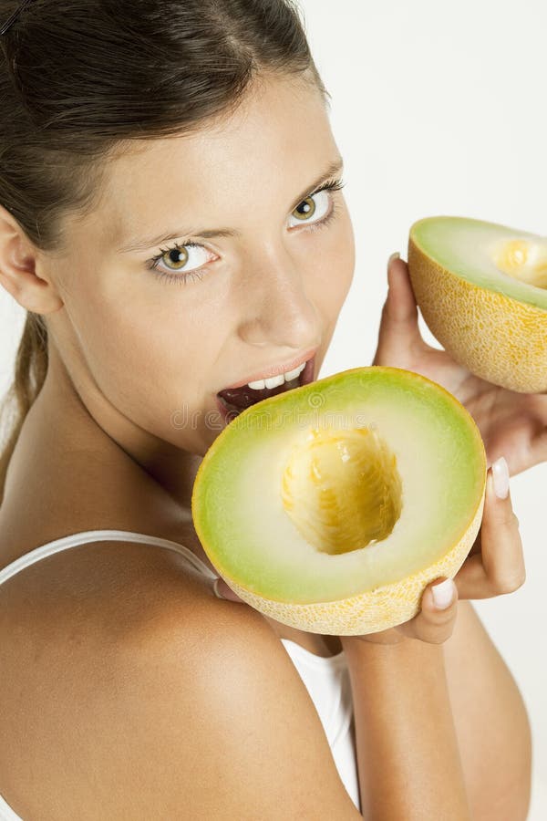 Woman with melon galia stock image. Image of fruits, nutrition 12213015