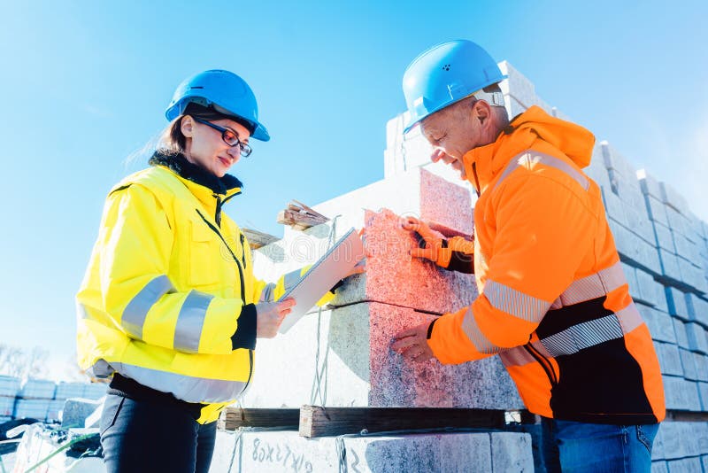 Logistics worker with construction material to be transported royalty free stock photography