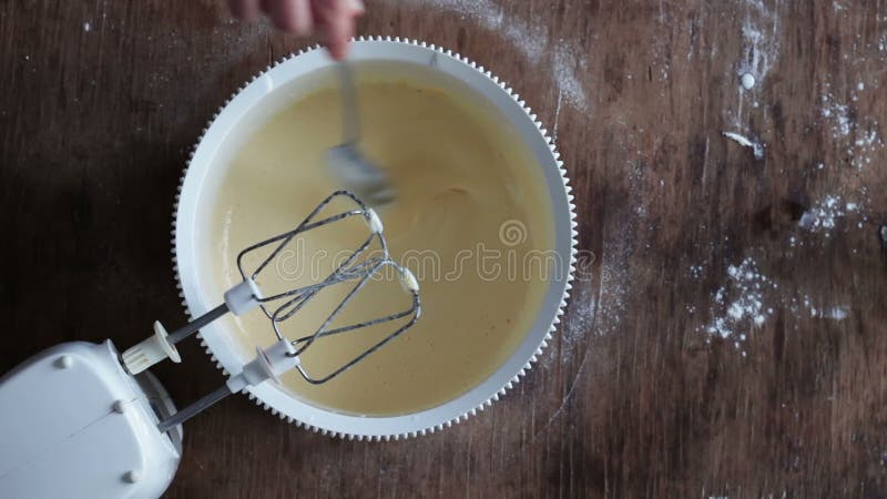 Woman mixing dough with a spoon