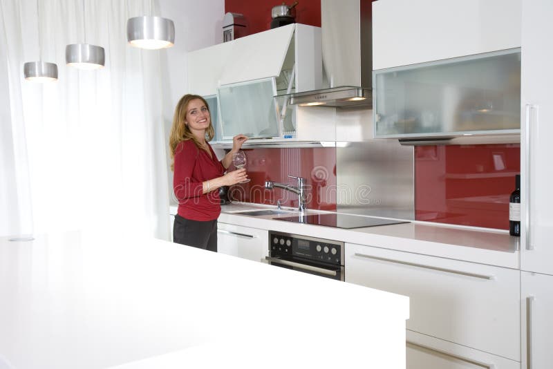 Woman in modern kitchen