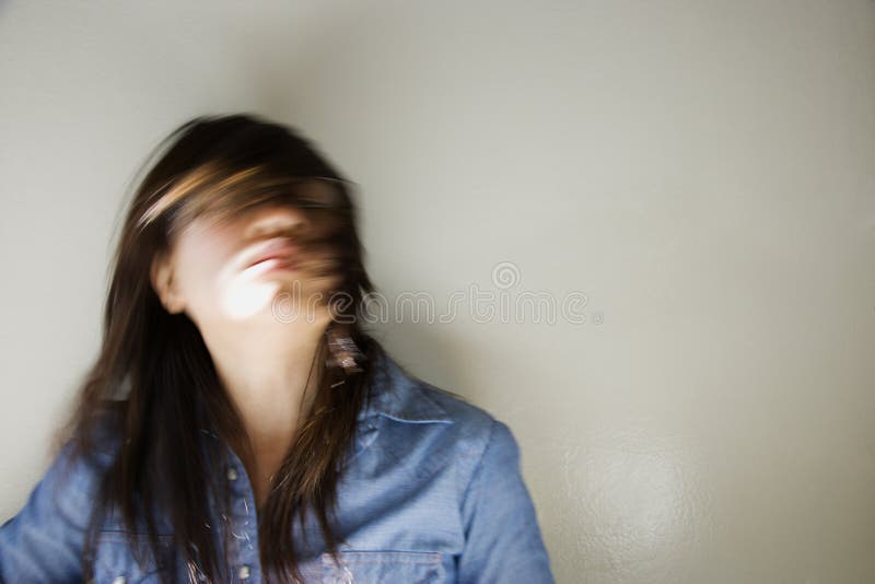 Pretty young Asian woman with swinging head and hair around. Pretty young Asian woman with swinging head and hair around.