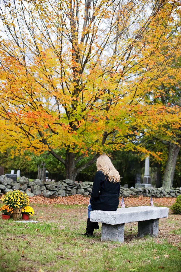 Woman mourning in cemetery stock image Woman mourning in cemetery stock image