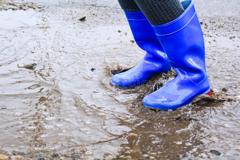 Gumboots and a puddle stock photo. Image of playful, natural - 26037914