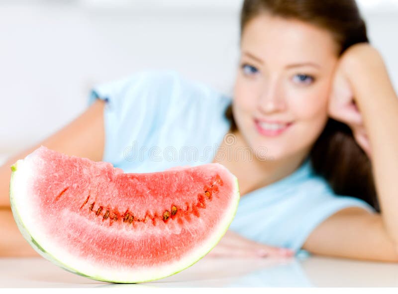 Woman near to a red water-melon