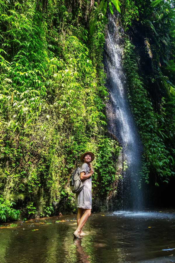 Woman near waterfal on Bali, Indonesia royalty free stock photos Woman near waterfal on Bali, Indonesia royalty free stock photos