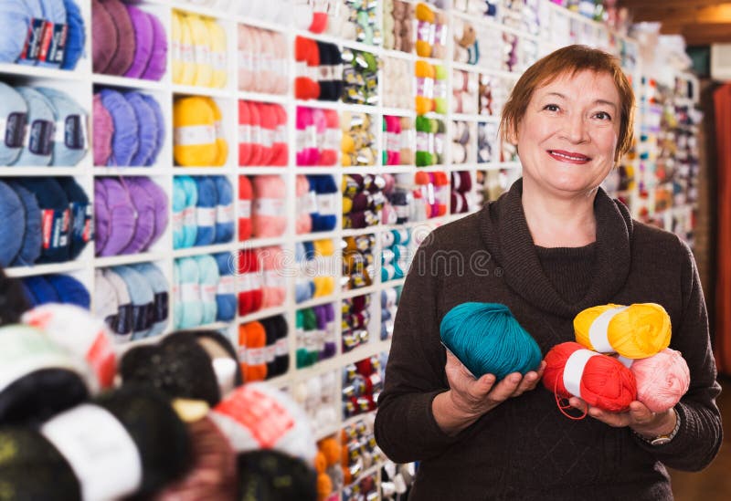 Woman in needlework shop stock image. Image of knitting 224519375
