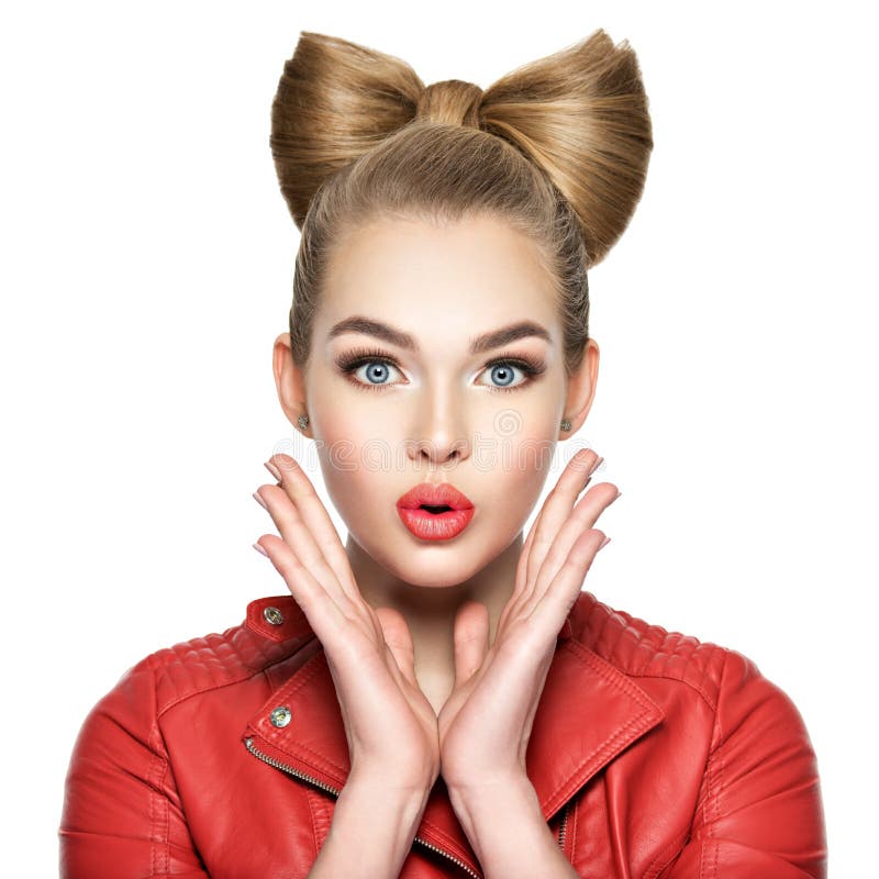 Woman with a nice hairstyle, red lipstick and a red jacket. Girl surprised and excited