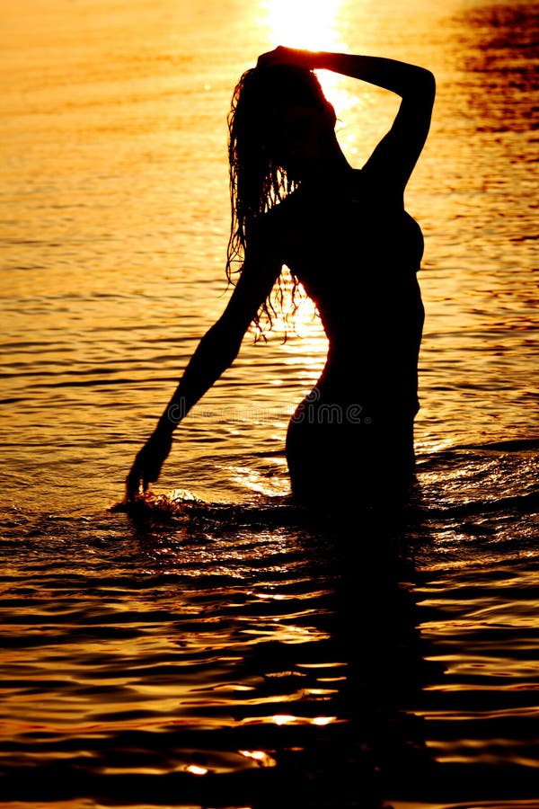Woman in ocean stock images
