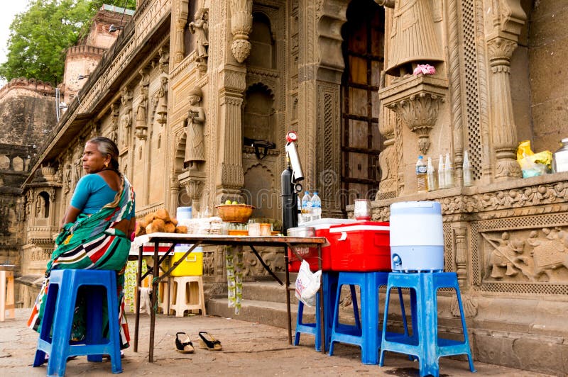 Woman offering cold drinks and snacks in a fort