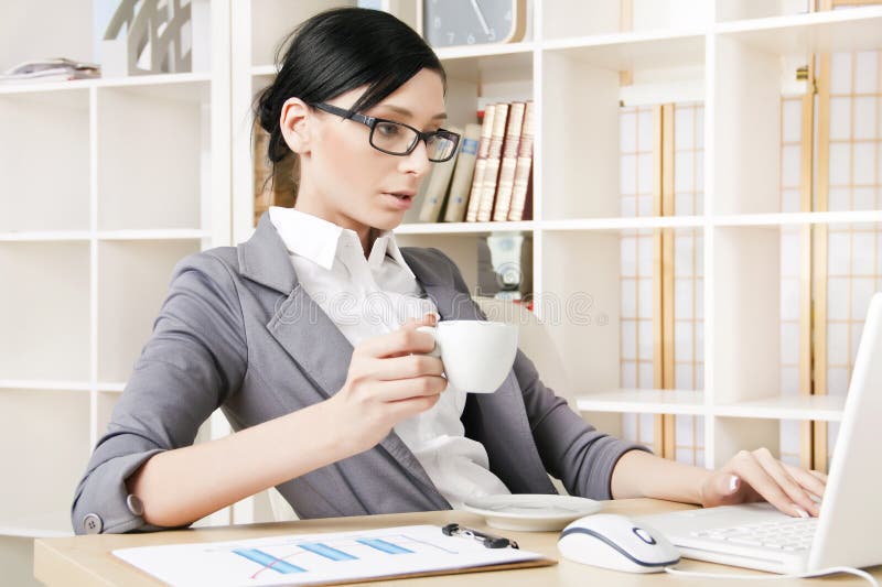 woman at the office with a cup of coffee