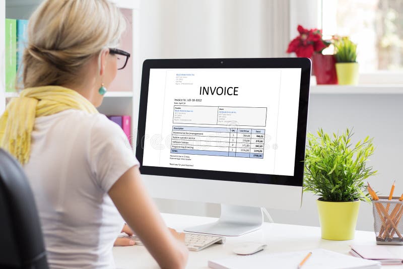 Woman in office with sample invoice document on computer stock photography Woman in office with sample invoice document on computer stock photography