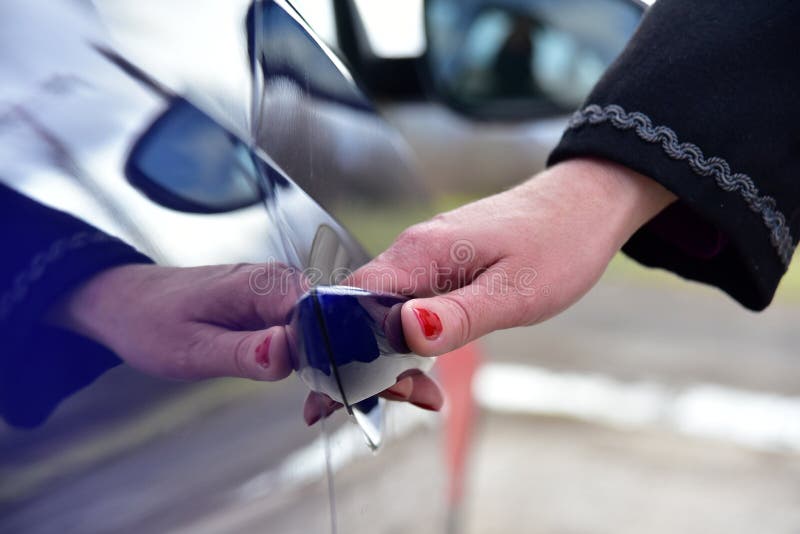 A woman opens the car door stock photo. Image of holding 254107074