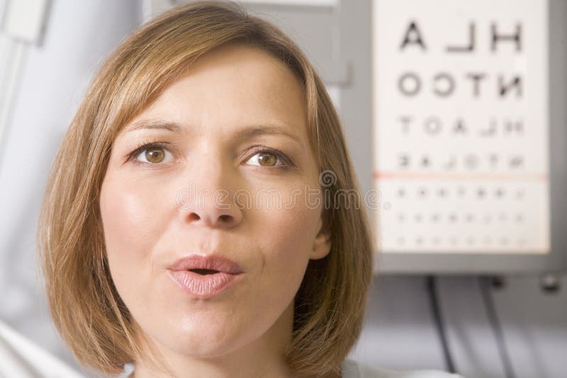 Woman in optometrist's exam room stock photos