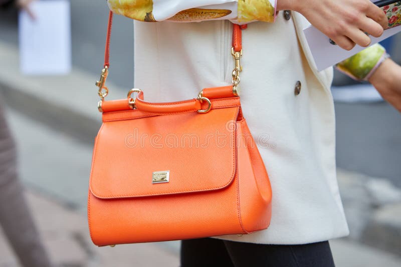 Woman with Orange Dolce E Gabbana Leather Bag before Salvatore Ferragamo  Fashion Show, Milan Fashion Week Editorial Image - Image of outfit, style:  195185525