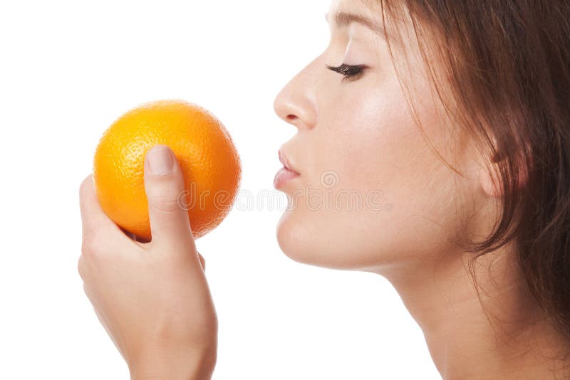 The woman with an orange fruit