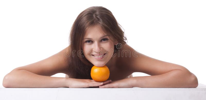 The woman with an orange fruit