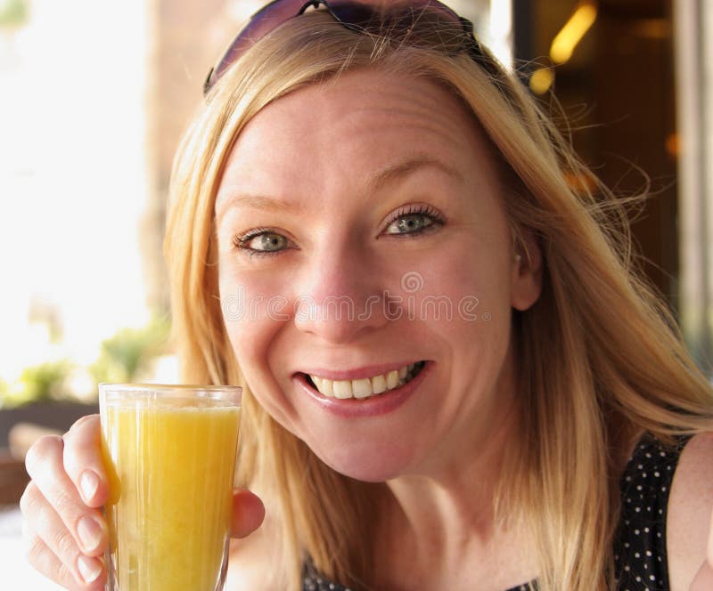 Woman with orange juice stock image. Image of laugh, health 21244305