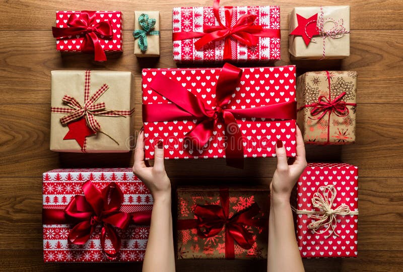 Woman organising beautifully wrapped vintage christmas presents, view from above royalty free stock image
