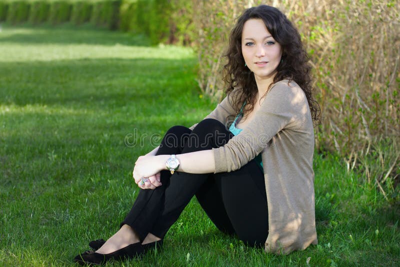 Woman outdoors sitting