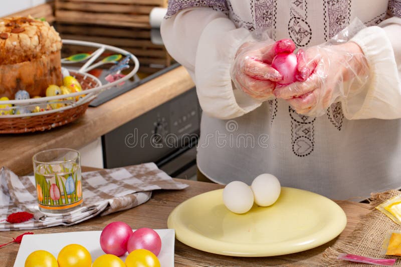 Person Paint a Egg Made of Polystyrene. Colorized Acrylic Egg Stock