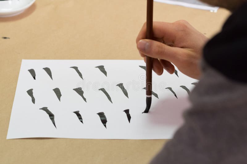 Woman painting calligraphy stock photo Woman painting calligraphy stock photo