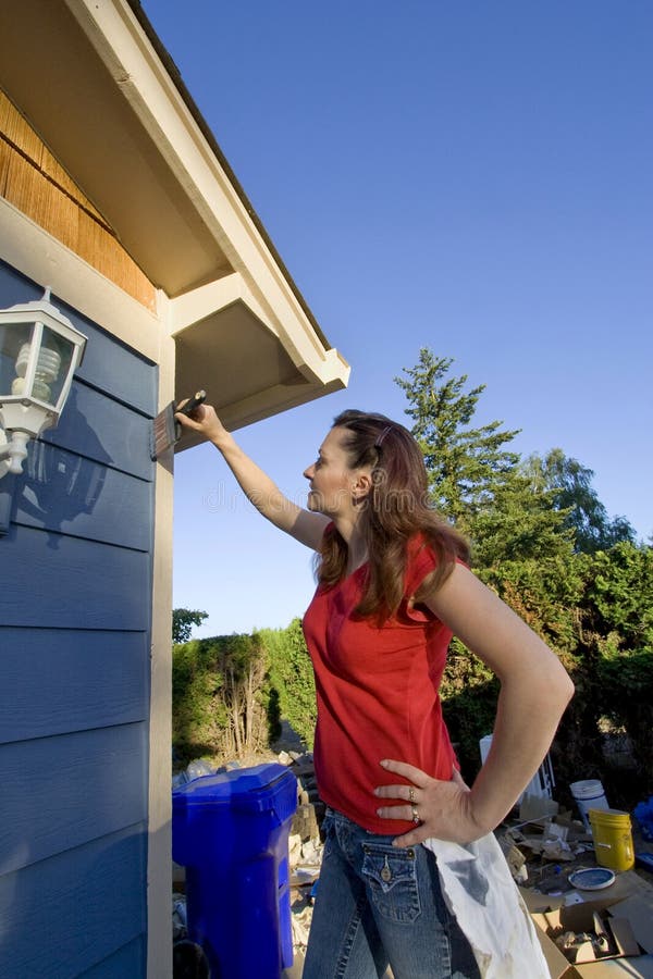 Woman Painting a House - Vertical