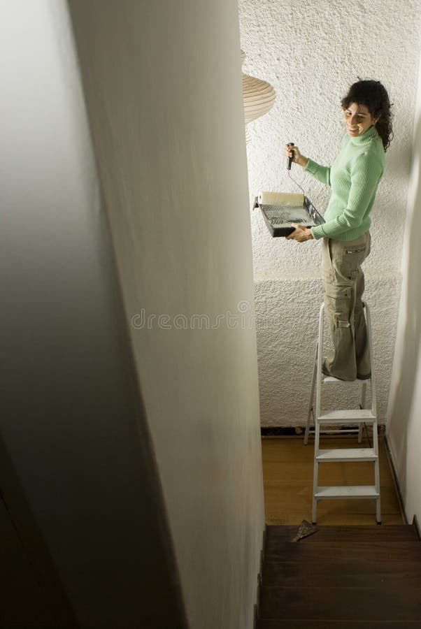 Woman Painting a Wall - Vertical