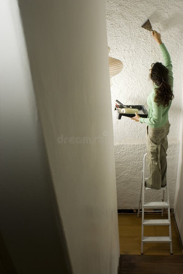 Woman Painting a Wall - Vertical
