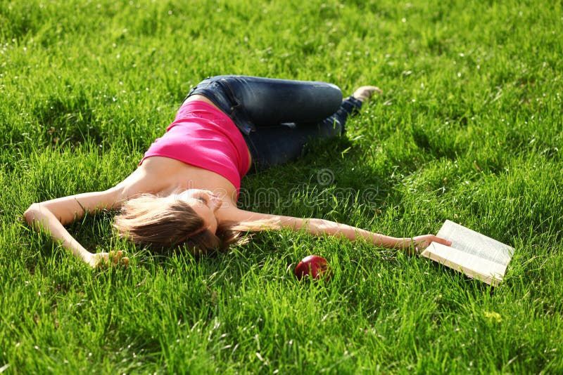 Woman in the park with book