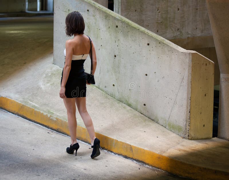 Woman in Parking Garage stock photo. Image of walking 33512322