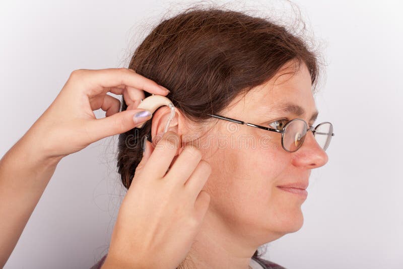 Woman patient fitting with a hearing aid