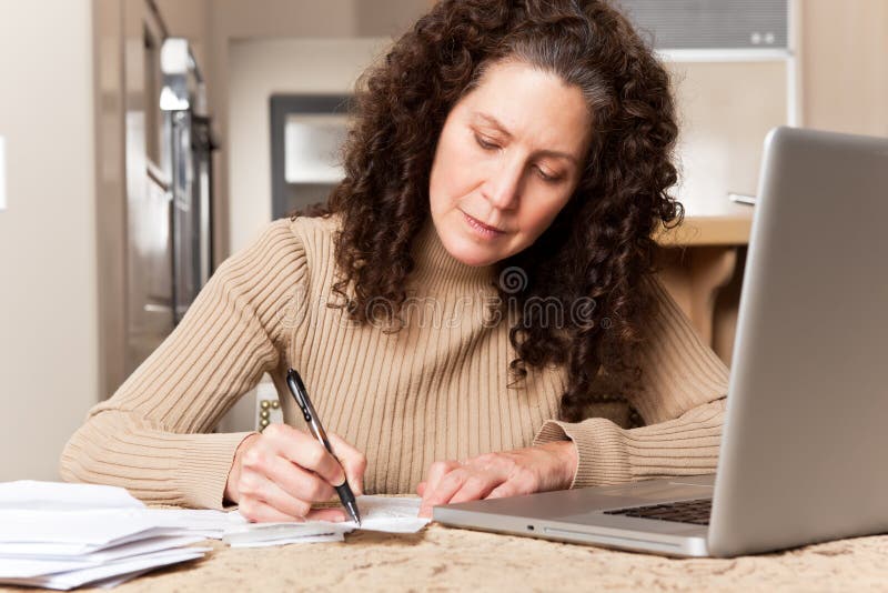 Woman paying bills royalty free stock images
