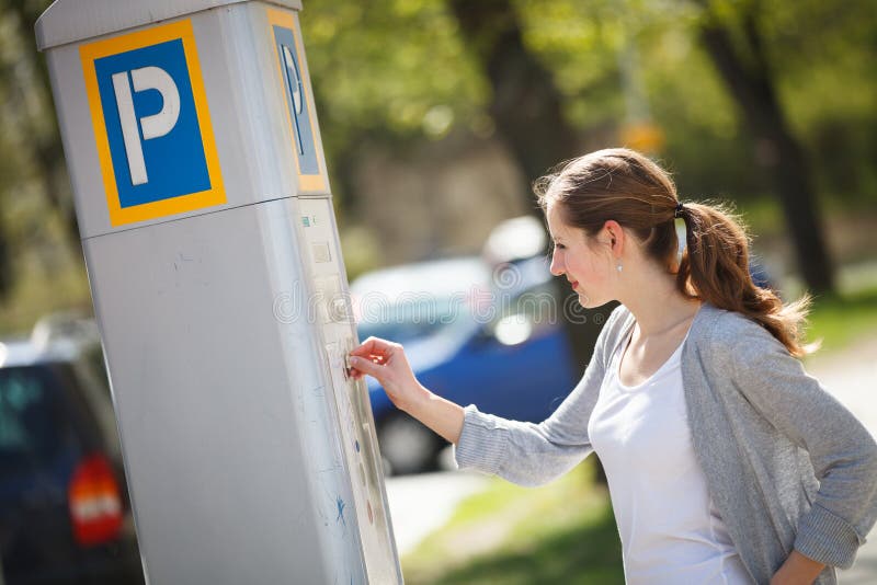Woman paying for parking stock photo. Image of center 37627536
