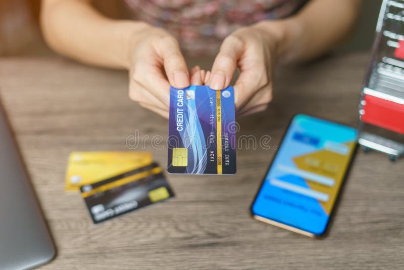 Woman is paying using a credit card, shopping and retail concept royalty free stock photos