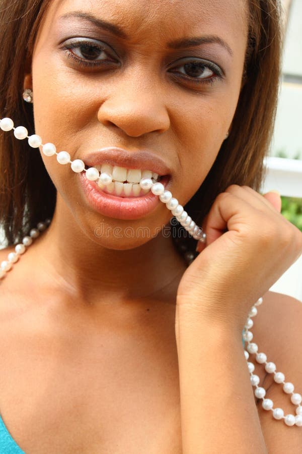 Woman With Pearls In Her Mouth