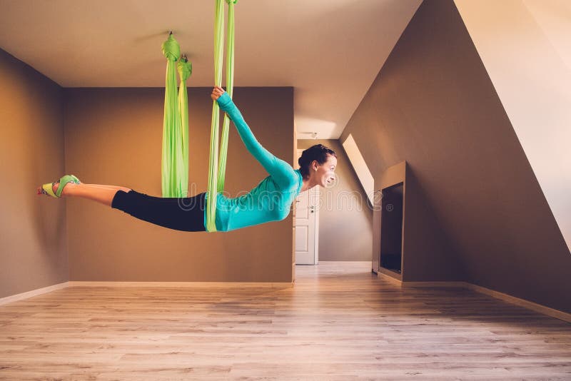Woman performing antigravity yoga stock photos