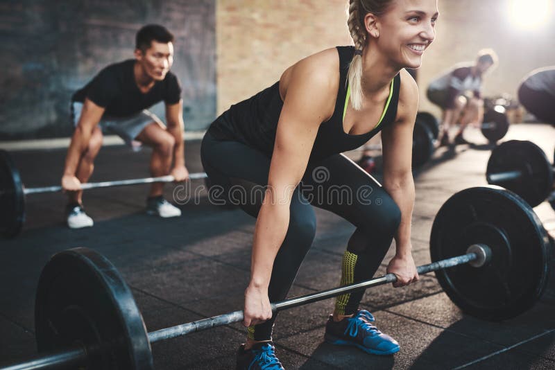 Woman performing dead lift barbell exercise royalty free stock image Woman performing dead lift barbell exercise royalty free stock image
