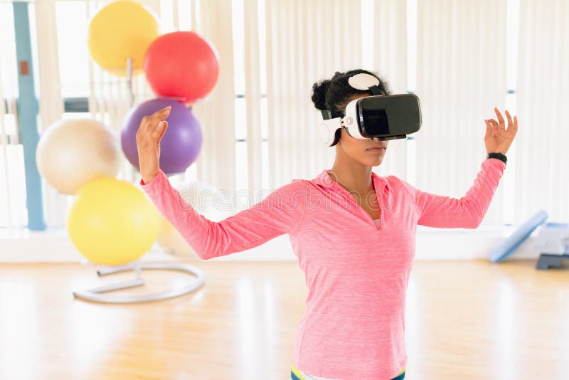 Woman Performing while Using Virtual Reality Headset Stock Photo