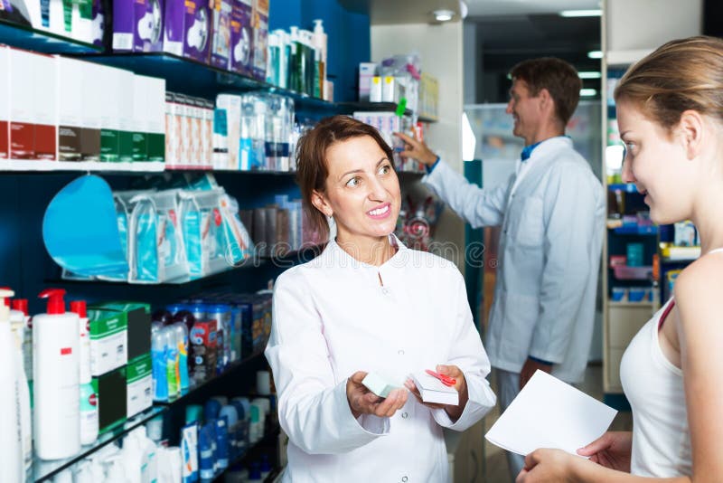 Woman Pharmacist in Drug Store Stock Image - Image of indoors, care ...