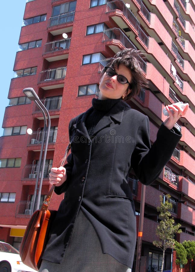 Download Woman with phone in a city stock image. Image of casual - 106915