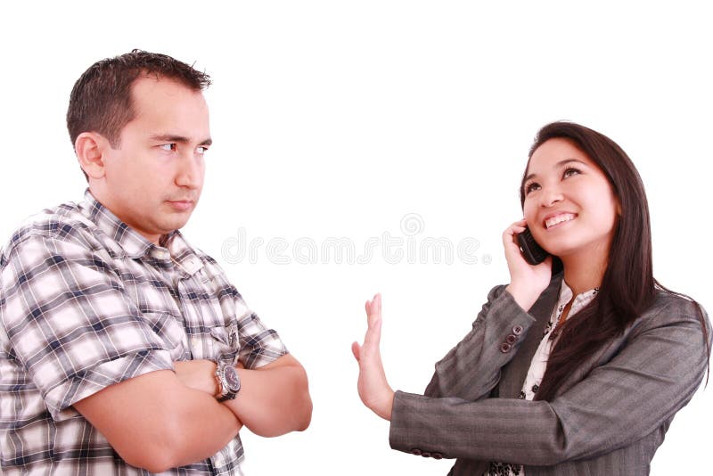 Woman on the phone signaling his couple to hold