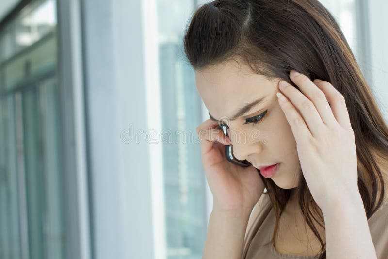 Woman with stress, anxiety, negative feeling, while using her phone. Woman with stress, anxiety, negative feeling, while using her phone