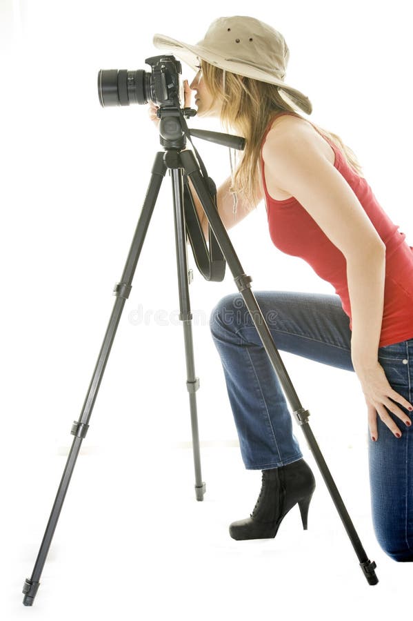 Woman with photo camera and tripod