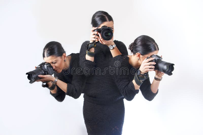 Young female photographer in an unusual position taking different photographs. Young female photographer in an unusual position taking different photographs