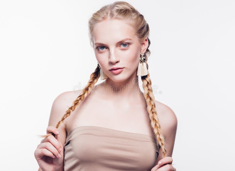 Woman with pigtails beauty healthy skin isolated on white blonde