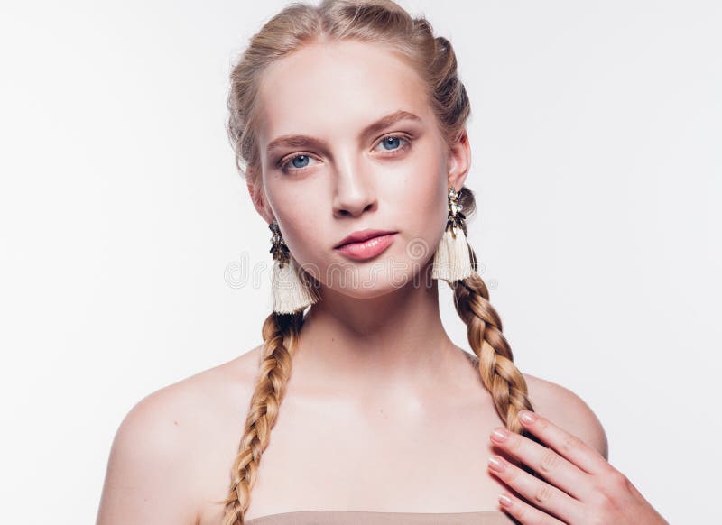 Woman with pigtails beauty healthy skin on white blonde