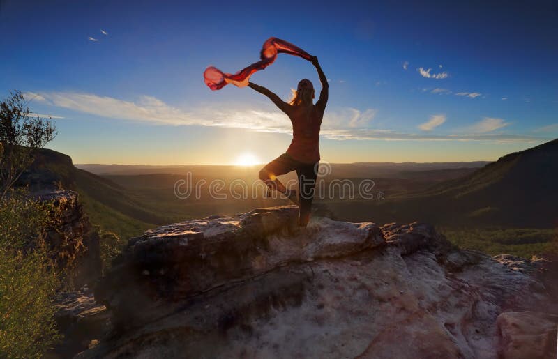 Woman Pilates Yoga balance with sheer flowing fabric stock photo Woman Pilates Yoga balance with sheer flowing fabric stock photo