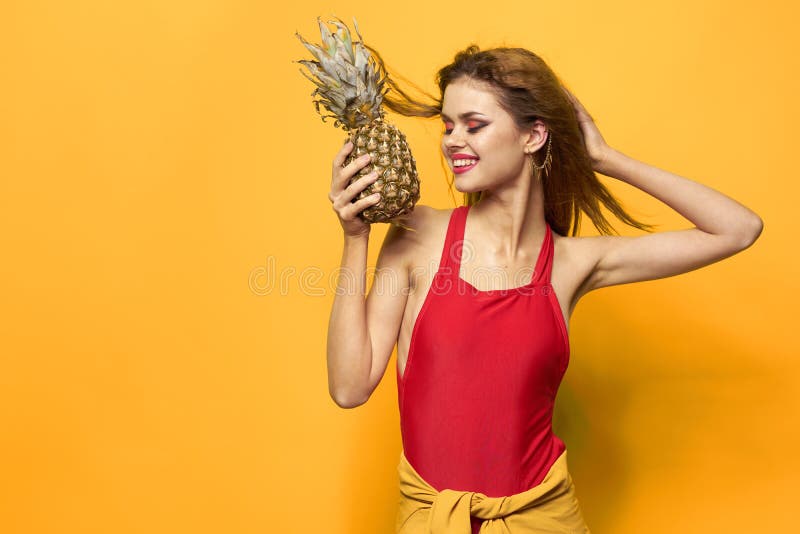 Woman with pineapple in stock photo. Image of beauty 215103914